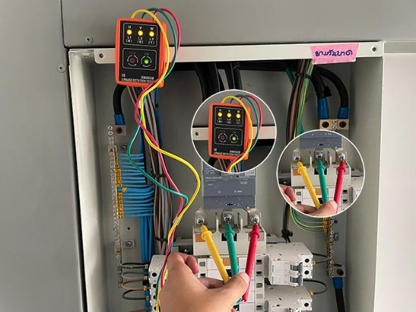 A hand holding multi colored wires

AI-generated content may be incorrect.