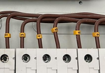 A group of wires with numbers on them

AI-generated content may be incorrect.