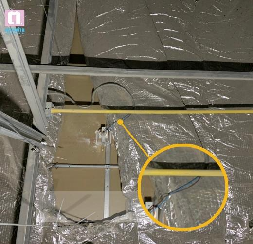 A yellow circle with wires and wires in a ceiling

AI-generated content may be incorrect.